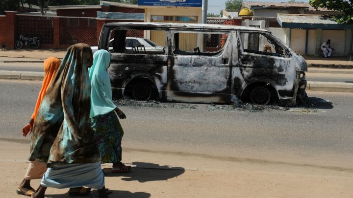 Women near exploded vehicle