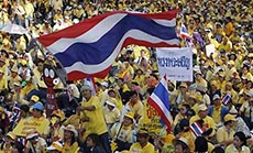 Thai PM Calls Elections as 100,000 Join Protests