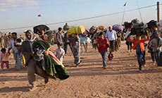 Turkish Troops Clash with Kurds, as Thousands Flee ISIL