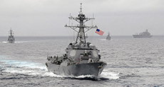 China Furious After US Navy Destroyer Passes Disputed Islands in S. China Sea

