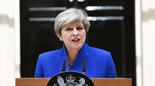 May Apologizes to Tory MPs after Humiliating Defeat