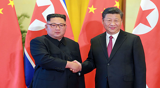 Kim Hails Unity with China 