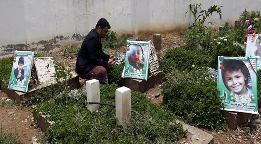 A Yemeni visiting a children's graveyard 