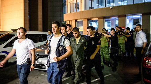 Turkish anti riot police officers escort Turkish soldiers who allegedly took part in a military coup