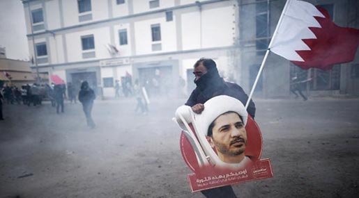 Protester holding poster of prominent opposition leader Sheikh Ali Salman 