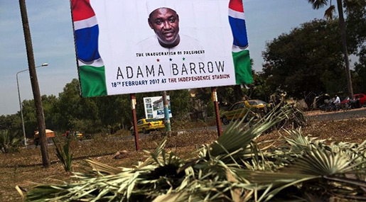 A billboard calling for the inauguration of Adam Barrow as president.