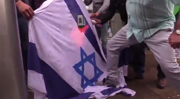 "Israeli" flag being burned in a UK protest
