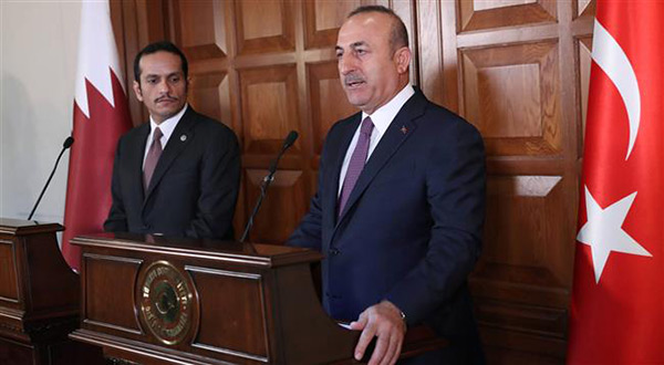 Qatari Foreign Minister Sheikh Mohammed bin Abdulrahman Al Thani with his Turkish counterpart Mevlut Cavusoglu
