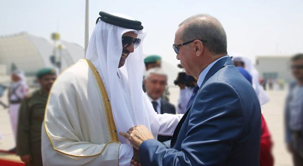Turkish President Tayyip Erdogan is welcomed by Emir of Qatar Sheikh Tamim Bin Hamad Al-Thani