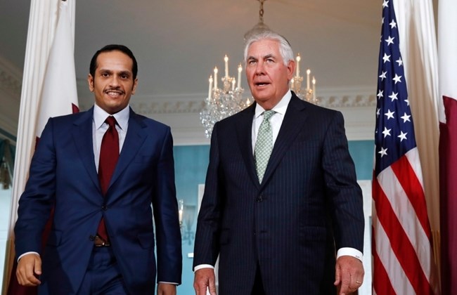Secretary of State Rex Tillerson, right, meets with Qatari Foreign Minister Mohammed bin Abdulrahman Al Than