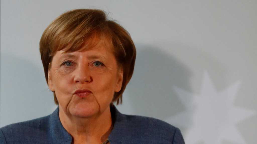 Germany’s Merkel Faces Questions over Migration, Ties to US