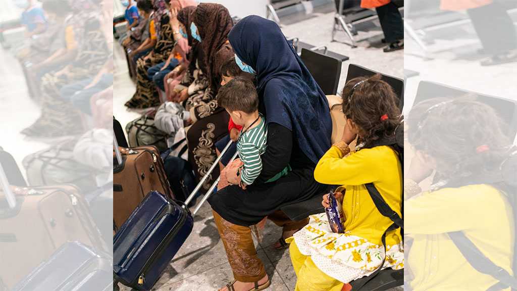 Shoeless, Shivering, Passing Out: Afghan Refugees Arrive In the UK