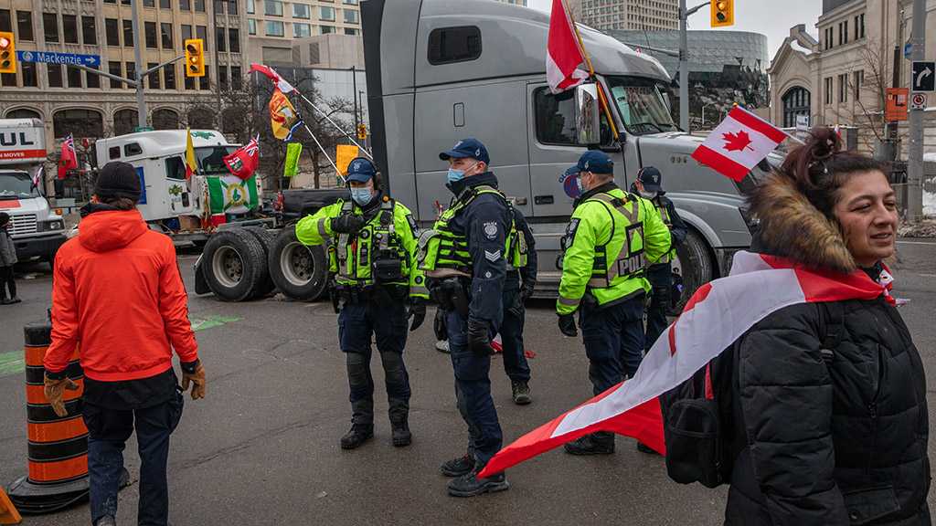 Ottawa Protesters Defy Canadian Police Threat with Fuel Cans