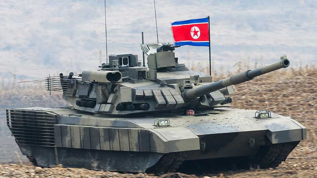 Kim Jong-un Drives Tank in Mock Battle